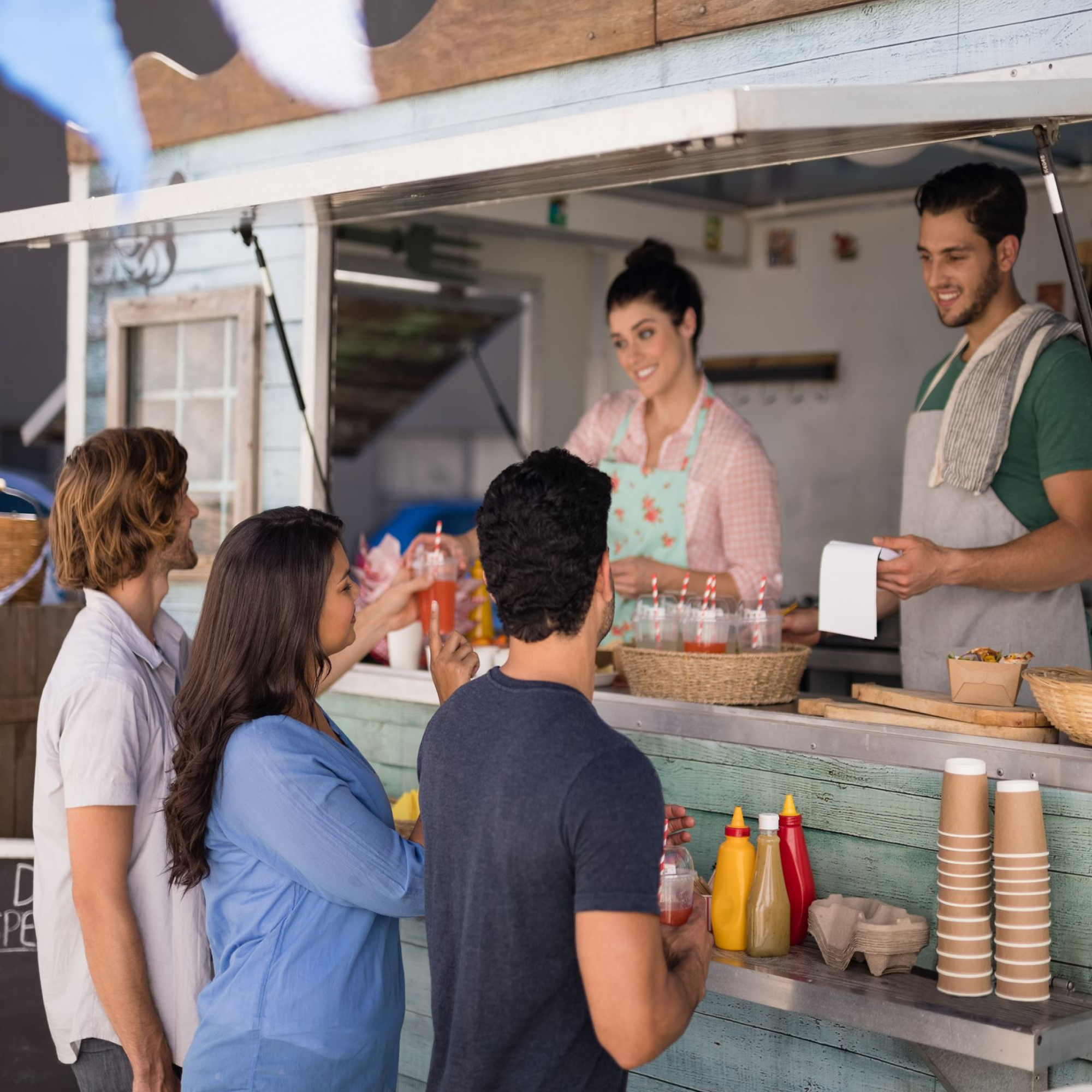 people buying from the food truck during the day time